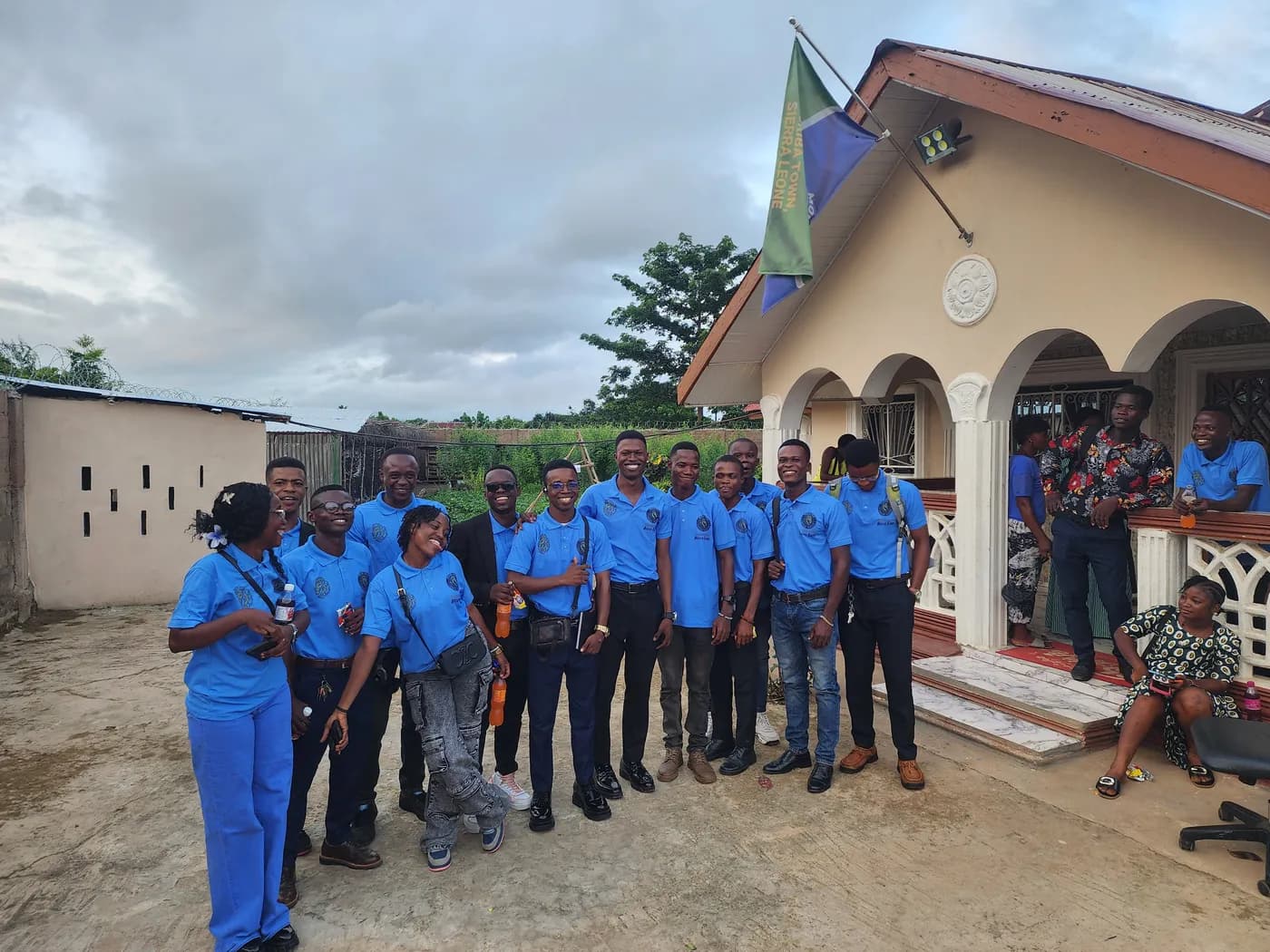 Students in blue uniforms gathered outside Moriba Senior Secondary School